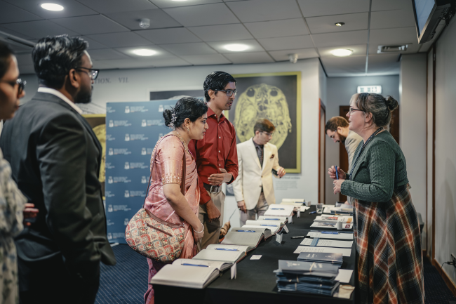 Ceremony attendants talking to College staff